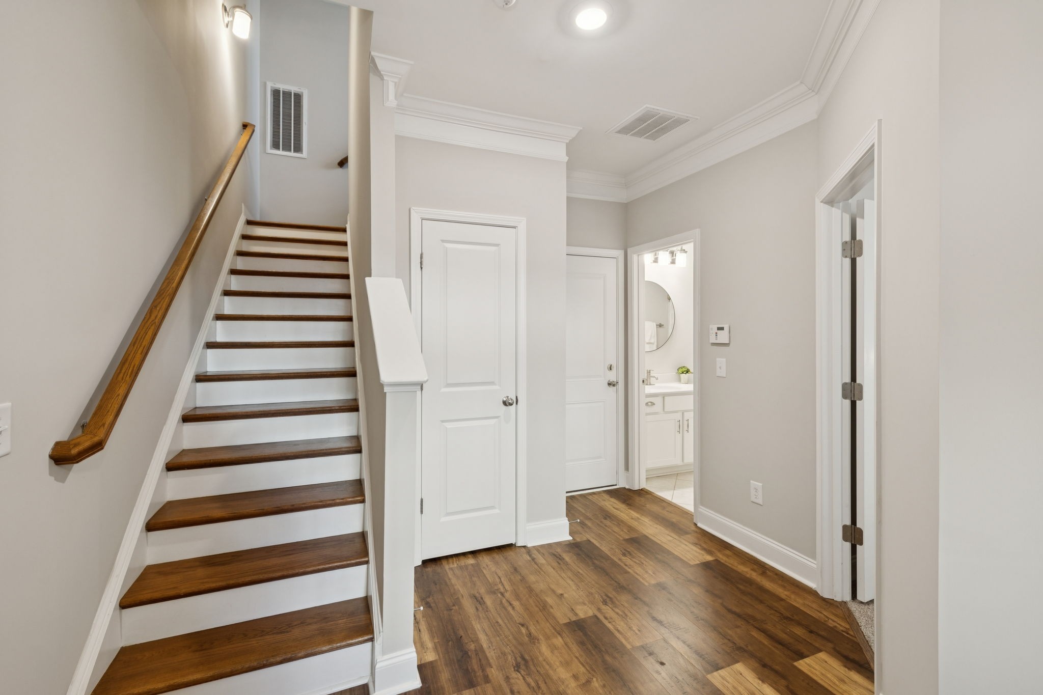 185 Burkitt Commons Avenue Nolensville, TN 37135 - Photo 5 of 46 a view of a hallway with wooden floor and white walls