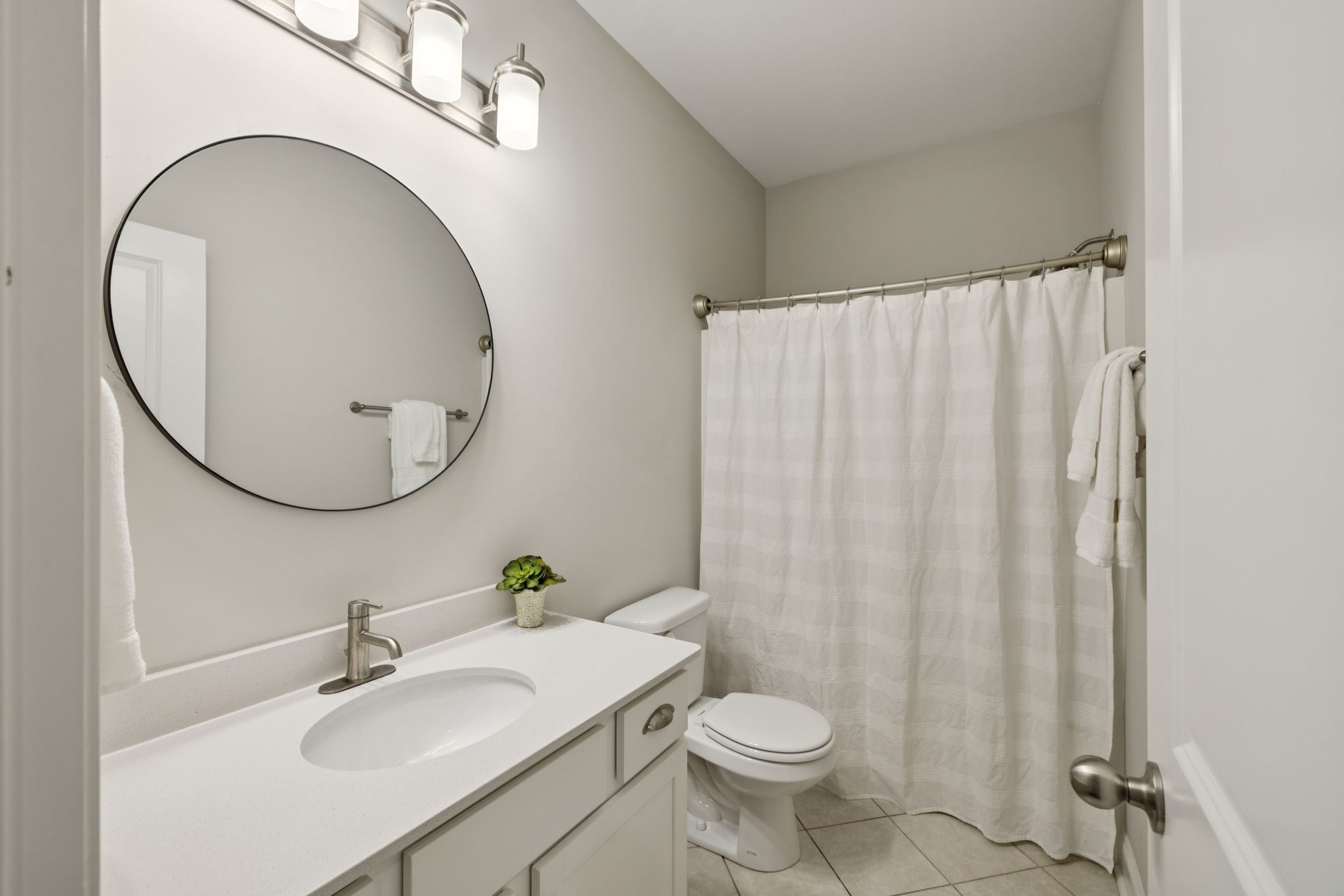185 Burkitt Commons Avenue Nolensville, TN 37135 - Photo 7 of 46 a bathroom with a sink a mirror and a toilet