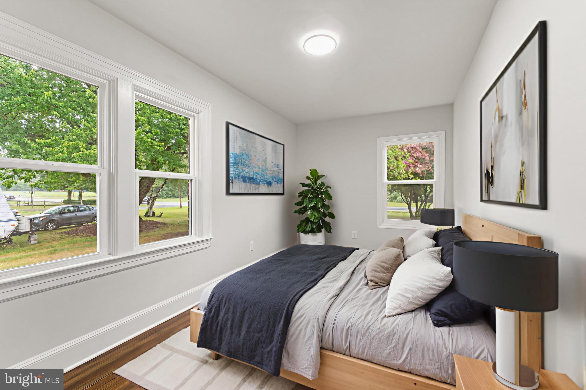 10221 Dahlgren Road King George, VA 22485 - Photo 10 of 31 a bedroom with a bed lamp and window