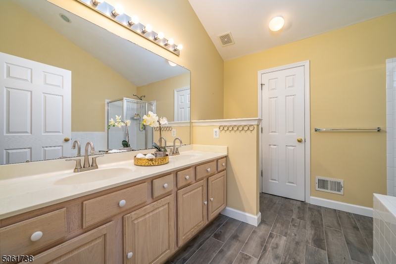 47 Battalion Drive Bernards, NJ 07920 - Photo 13 of 24 a spacious bathroom with a double vanity sink and a mirror