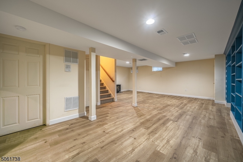 47 Battalion Drive Bernards, NJ 07920 - Photo 18 of 24 an empty room with wooden floor and windows