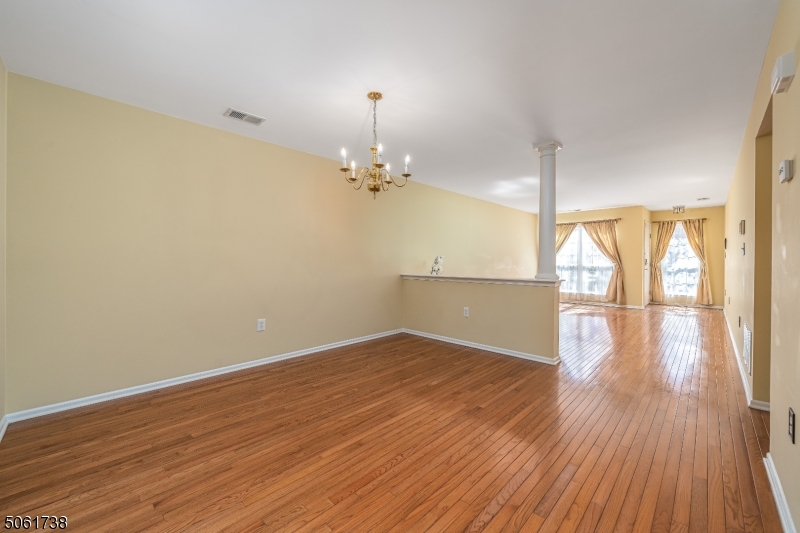 47 Battalion Drive Bernards, NJ 07920 - Photo 3 of 24 wooden floor in an empty room with a window