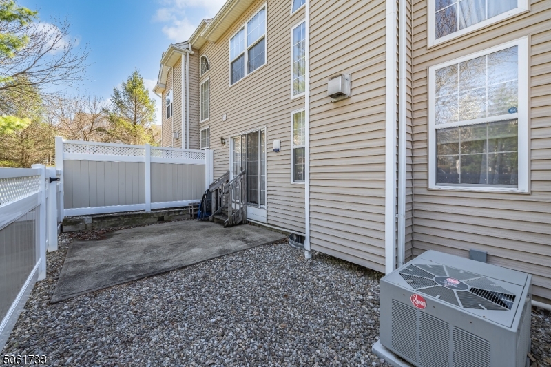 47 Battalion Drive Bernards, NJ 07920 - Photo 22 of 24 a view of a house with a backyard and a window