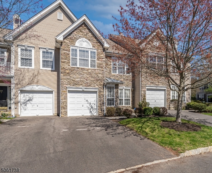 47 Battalion Drive Bernards, NJ 07920 - Photo 23 of 24 a front view of a house with a garden