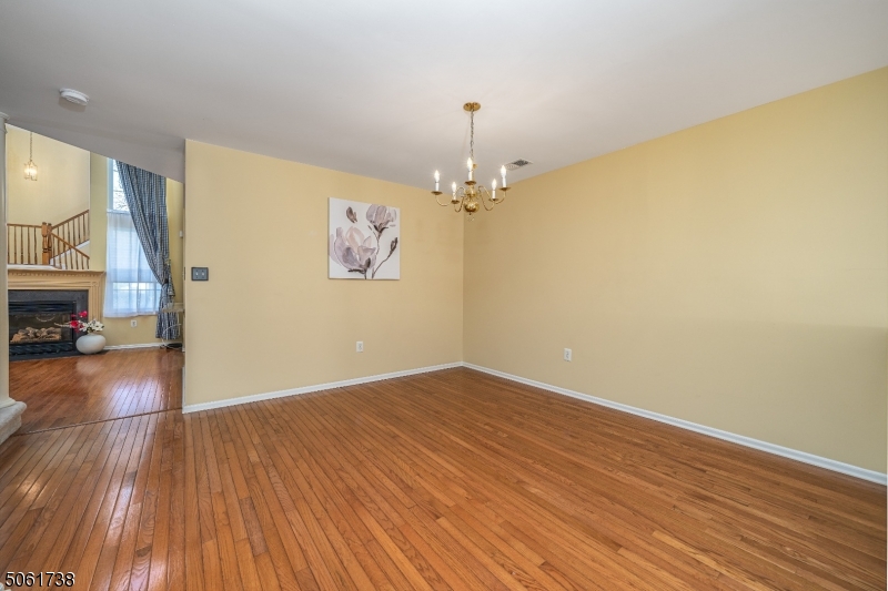 47 Battalion Drive Bernards, NJ 07920 - Photo 4 of 24 a view of livingroom with hardwood floor and a ceiling fan