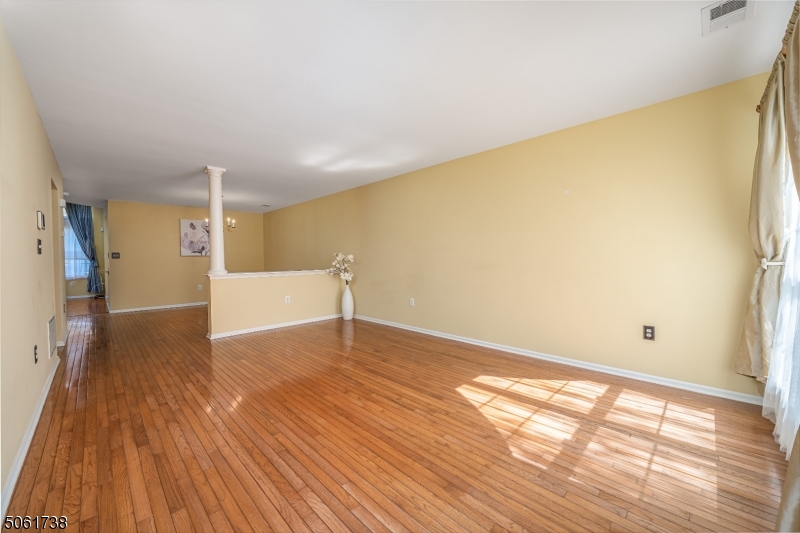 47 Battalion Drive Bernards, NJ 07920 - Photo 6 of 24 a view of empty room with wooden floor