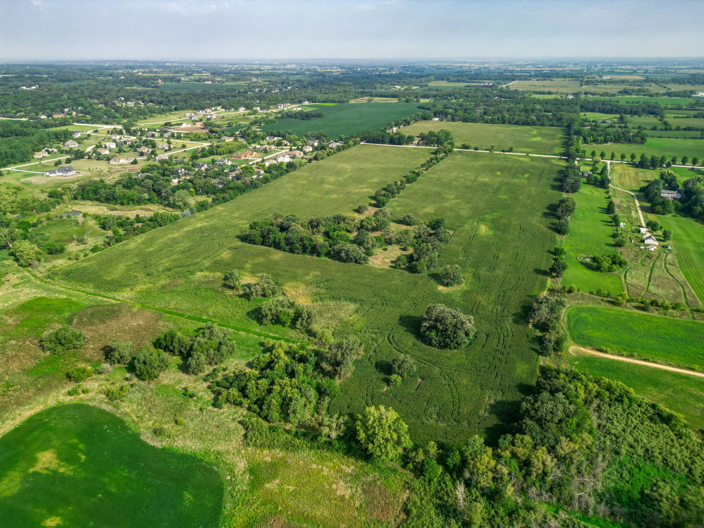 15218 Harmony Road Huntley, IL 60142 - Photo 6 of 13 an aerial view of residential houses with outdoor space and trees