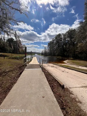 a view of a lake with a big yard
