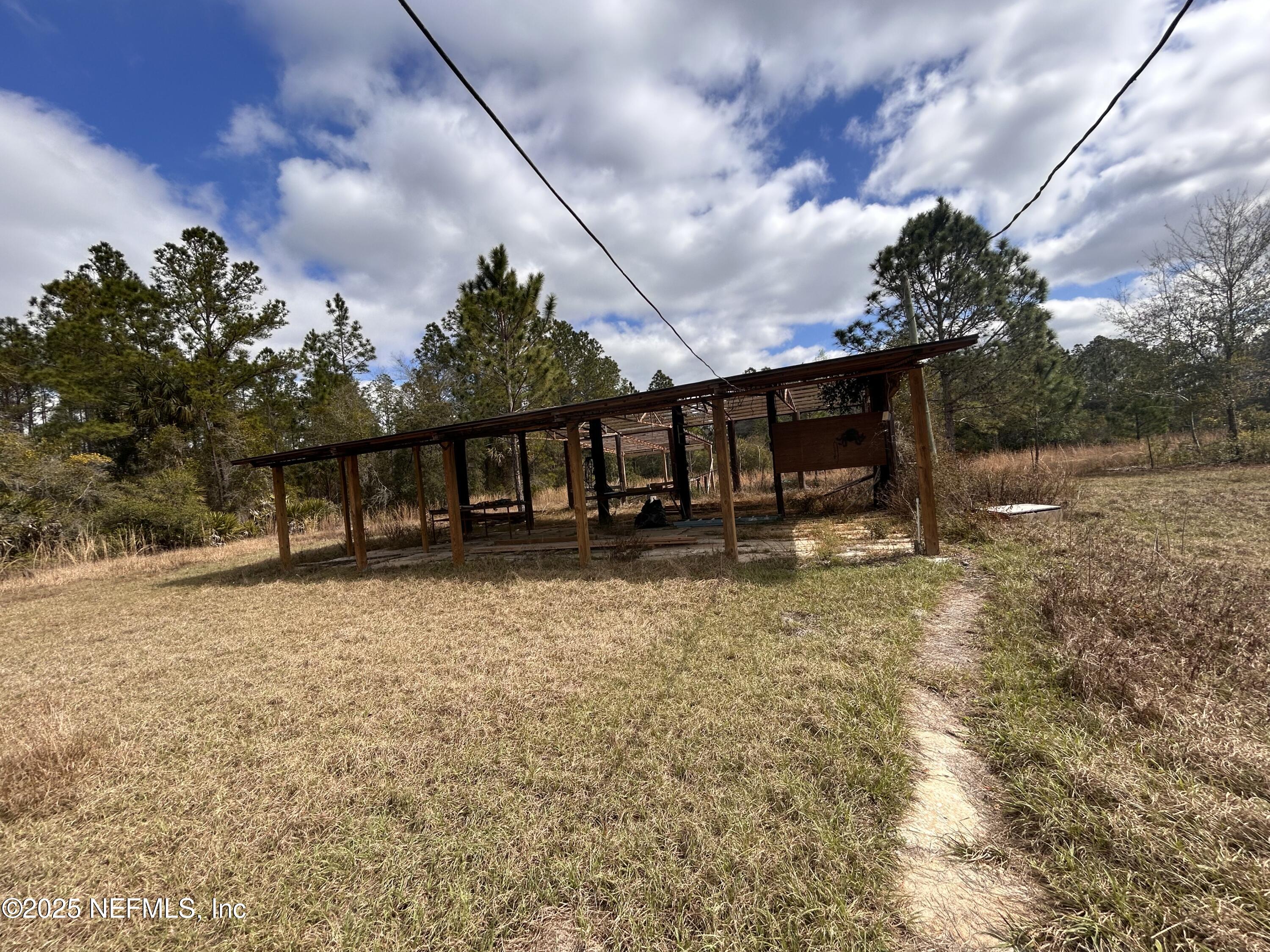 100 Kenwood Boat Ramp Road Interlachen, FL 32148 - Photo 14 of 19 a backyard of a house with lots of green space