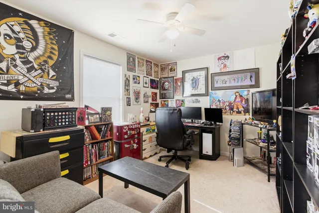 a view of a workspace with furniture and a livingroom