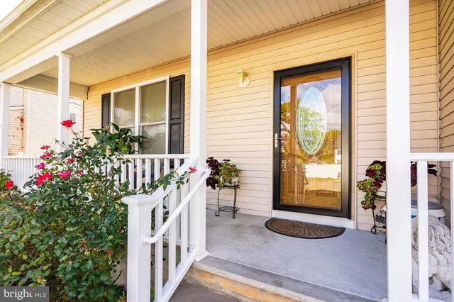 a front view of a house with a porch