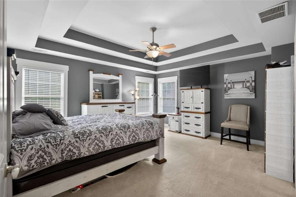 507 Rippling Court Temple, GA 30179 - Photo 21 of 31 a bedroom with a bed couch and a window