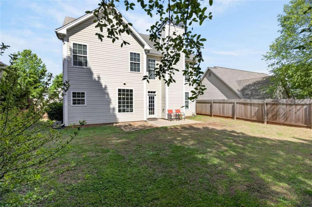 507 Rippling Court Temple, GA 30179 - Photo 25 of 31 a white house that has tree in front of it