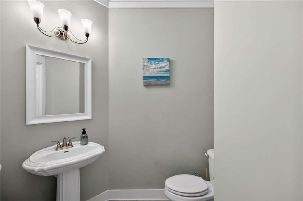 507 Rippling Court Temple, GA 30179 - Photo 6 of 31 a bathroom with a sink mirror and toilet