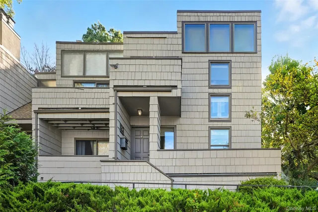 a view of a house with a window and balcony