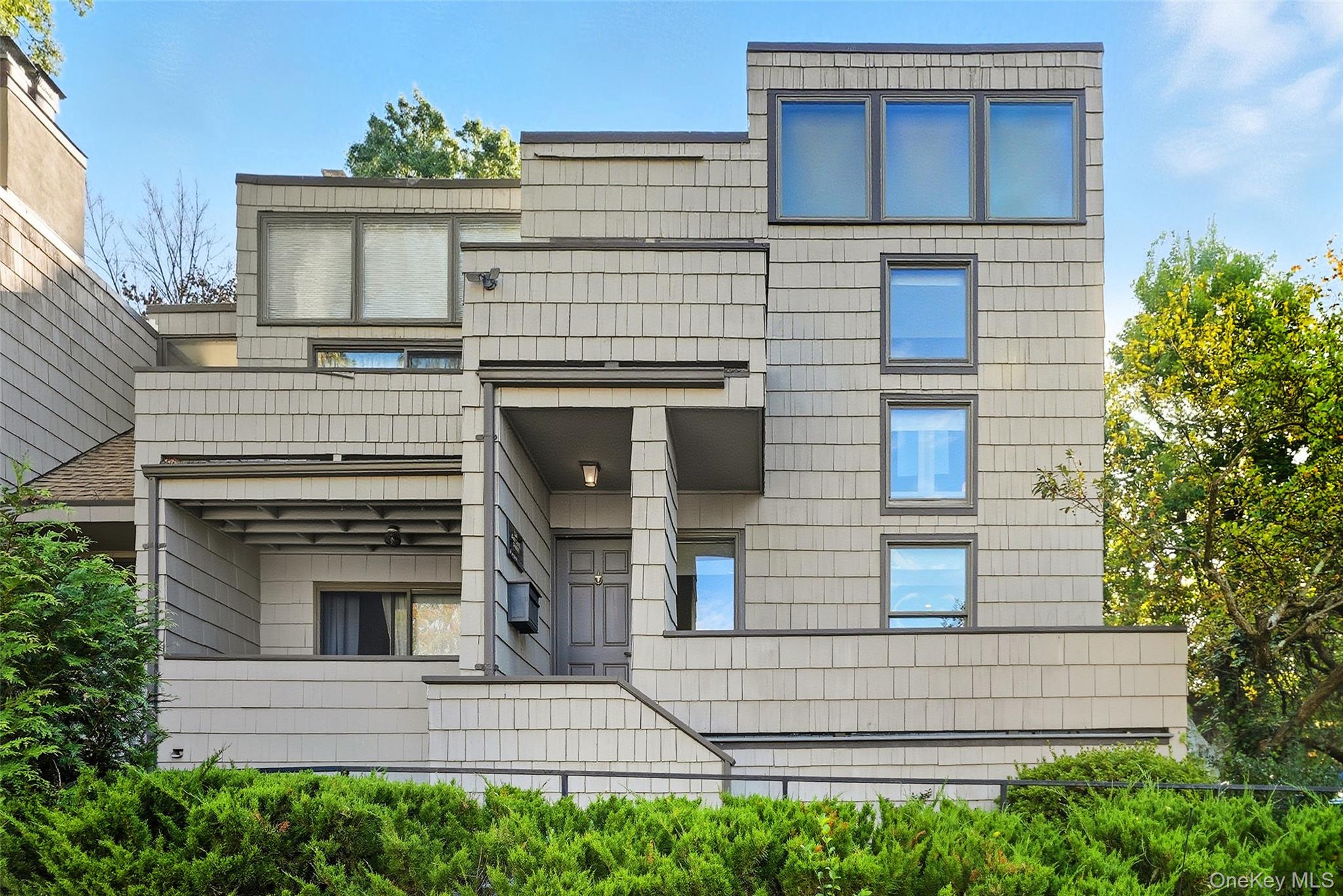 a view of a house with a window and balcony