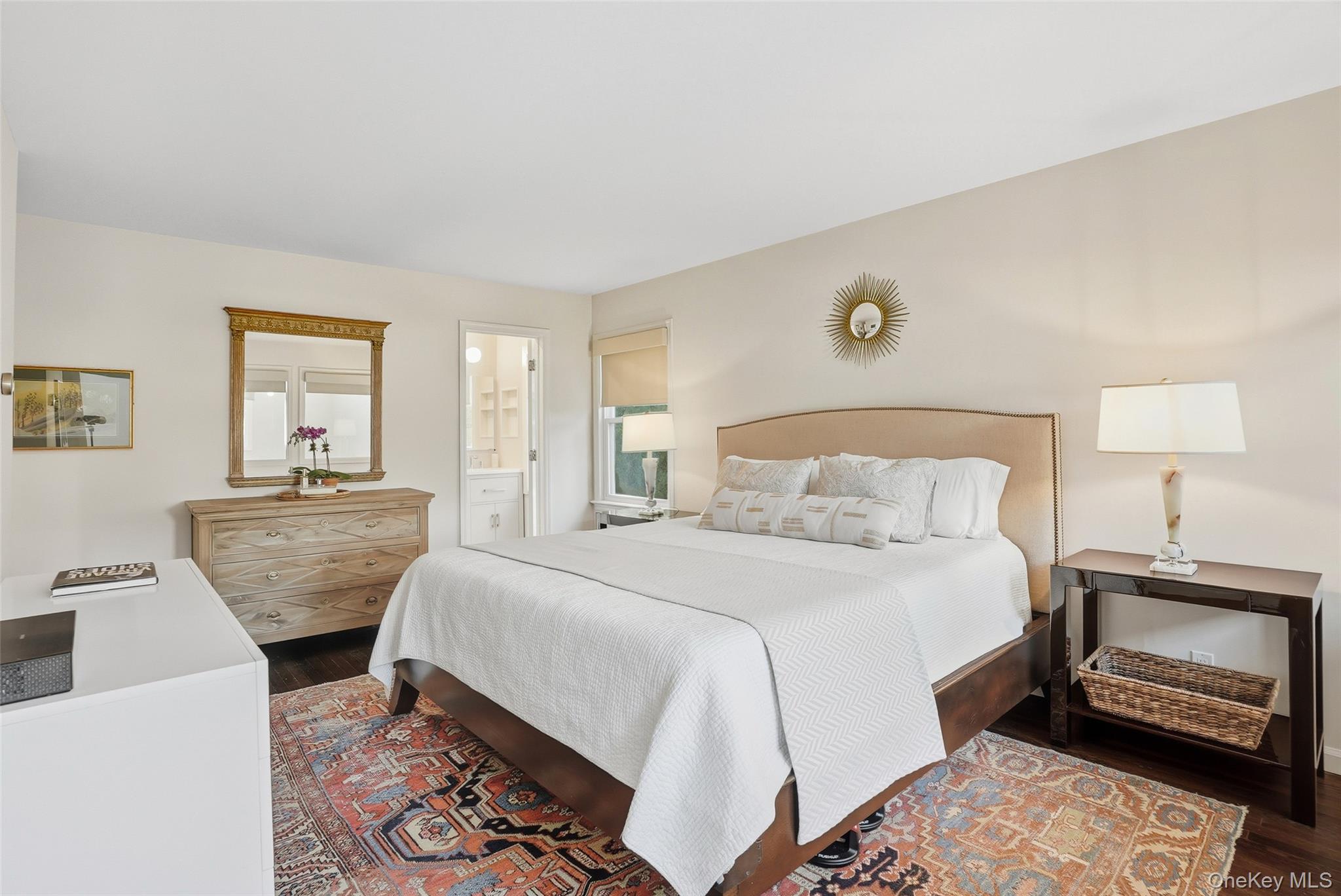 216 Purchase Street, Unit P Rye, NY 10580 - Photo 17 of 36 a bedroom with a bed a lamp and a window