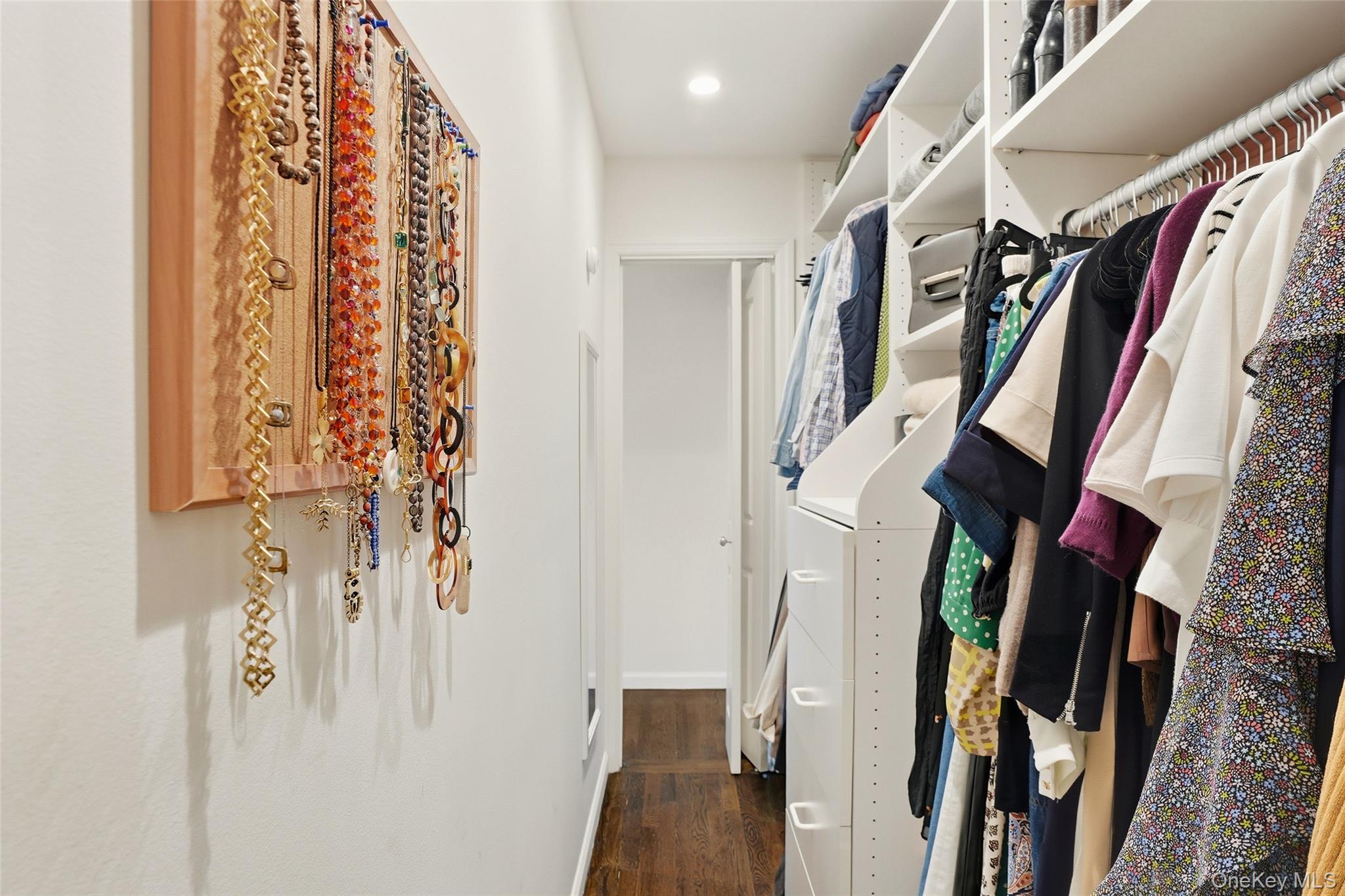 216 Purchase Street, Unit P Rye, NY 10580 - Photo 22 of 36 a view of walk in closet with clothes and shoes