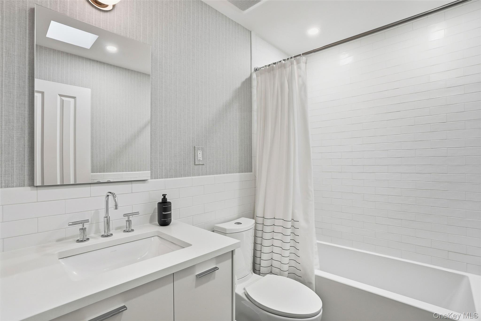 216 Purchase Street, Unit P Rye, NY 10580 - Photo 26 of 36 a bathroom with a sink toilet and shower