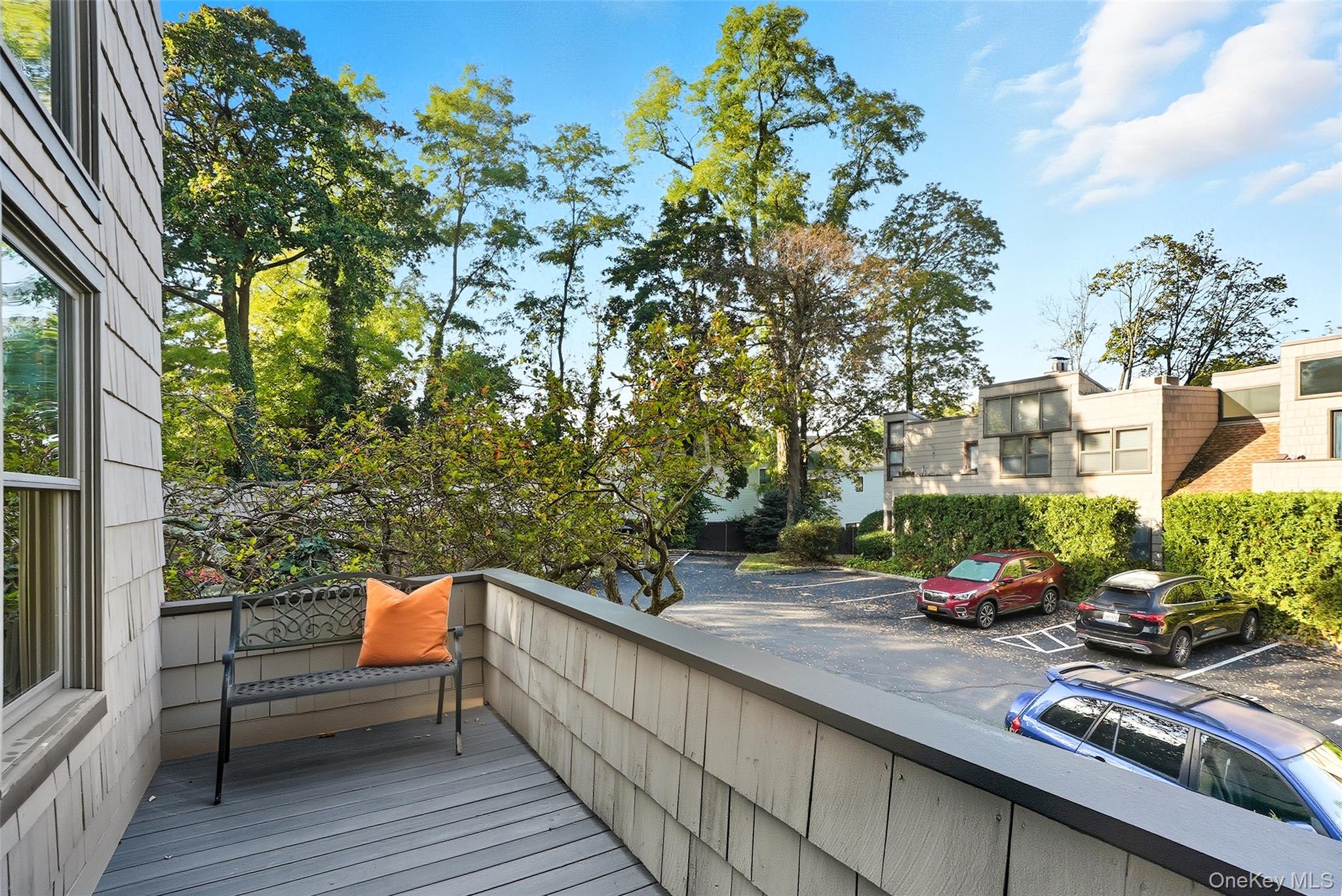 216 Purchase Street, Unit P Rye, NY 10580 - Photo 30 of 36 a view of a bench in a balcony