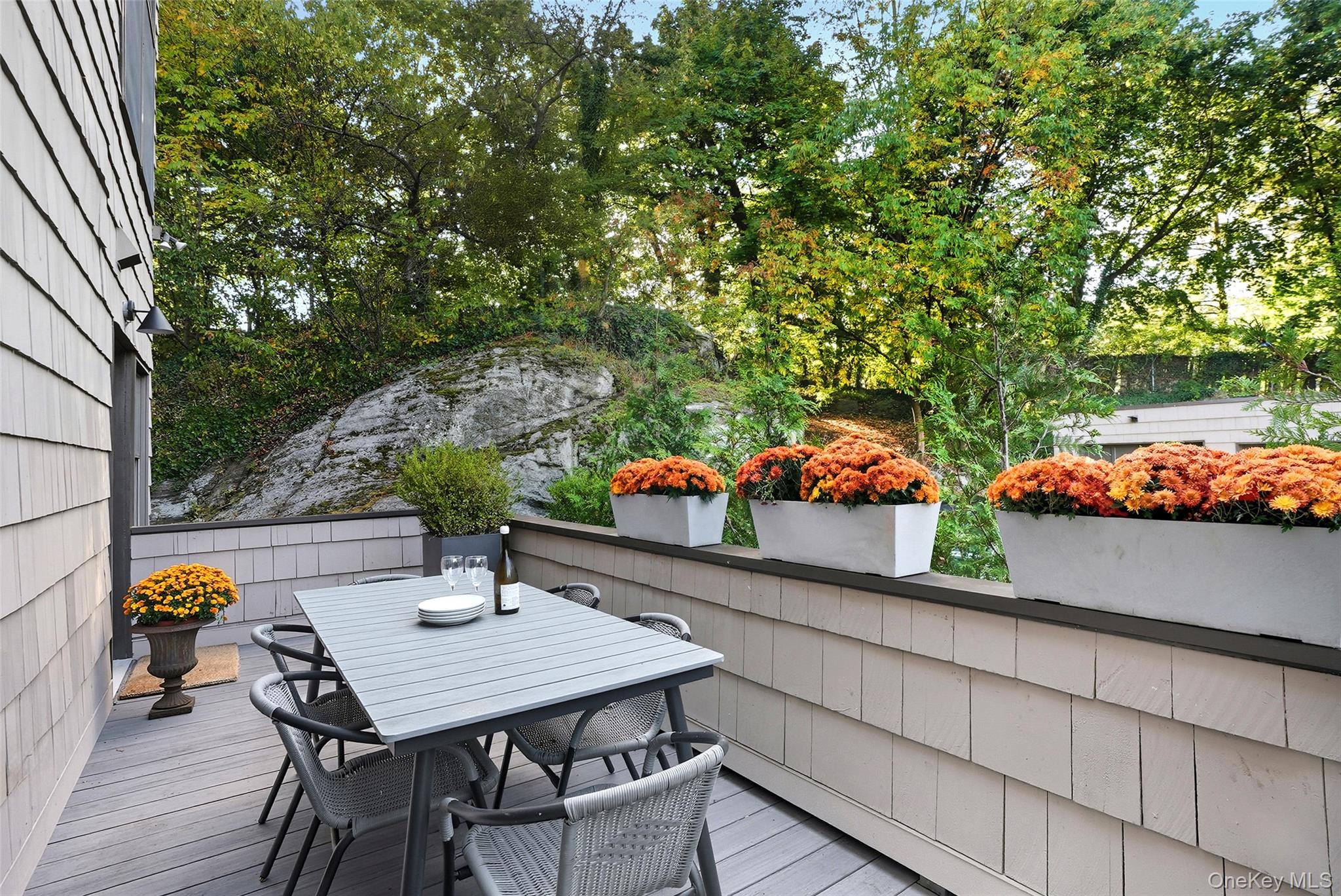 216 Purchase Street, Unit P Rye, NY 10580 - Photo 32 of 36 a view of a chairs and table on the wooden floor