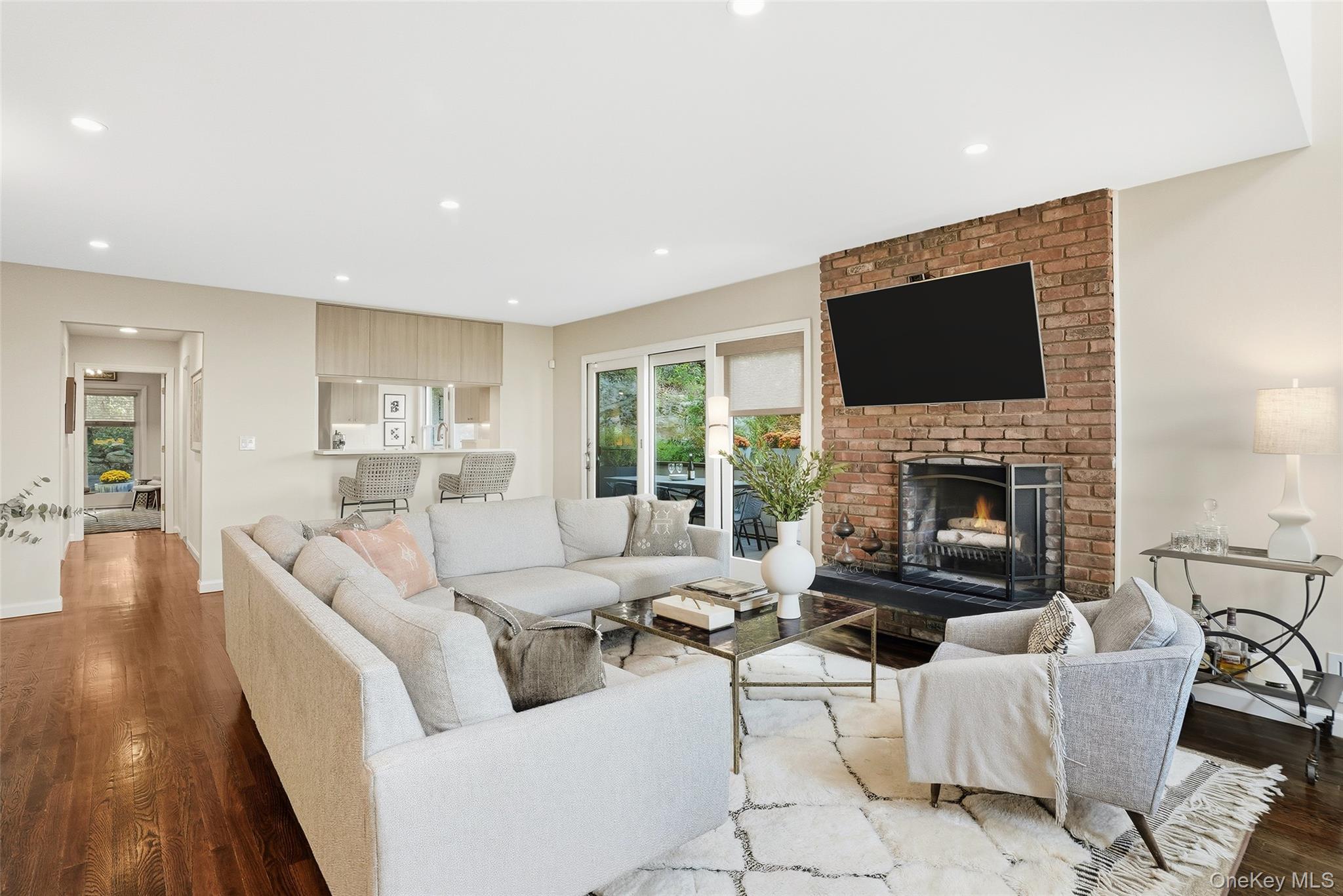 216 Purchase Street, Unit P Rye, NY 10580 - Photo 4 of 36 a living room with furniture fireplace and a flat screen tv