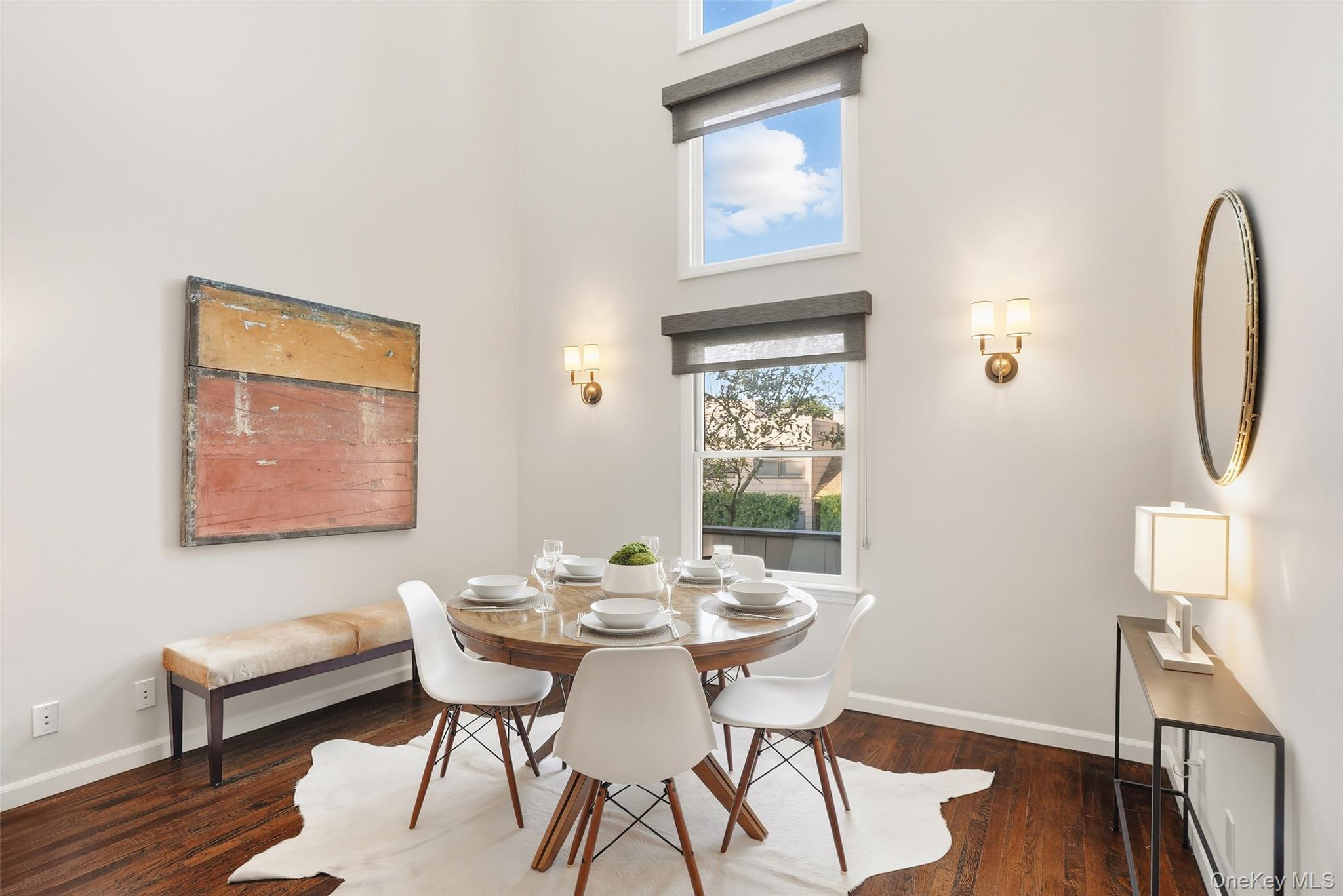 216 Purchase Street, Unit P Rye, NY 10580 - Photo 5 of 36 a view of a dining room with furniture and wooden floor