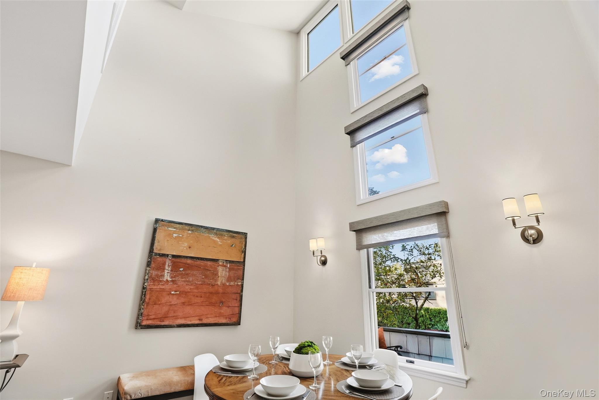 216 Purchase Street, Unit P Rye, NY 10580 - Photo 6 of 36 a view of a hallway with furniture and a window