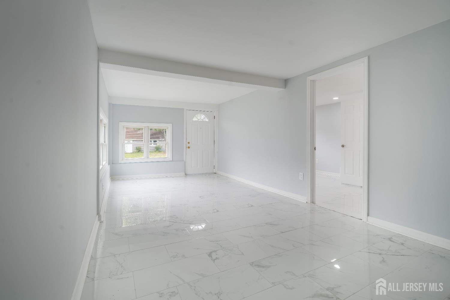 106 Boulevard West Old Bridge, NJ 07735 - Photo 14 of 34 an empty room with windows and mirror