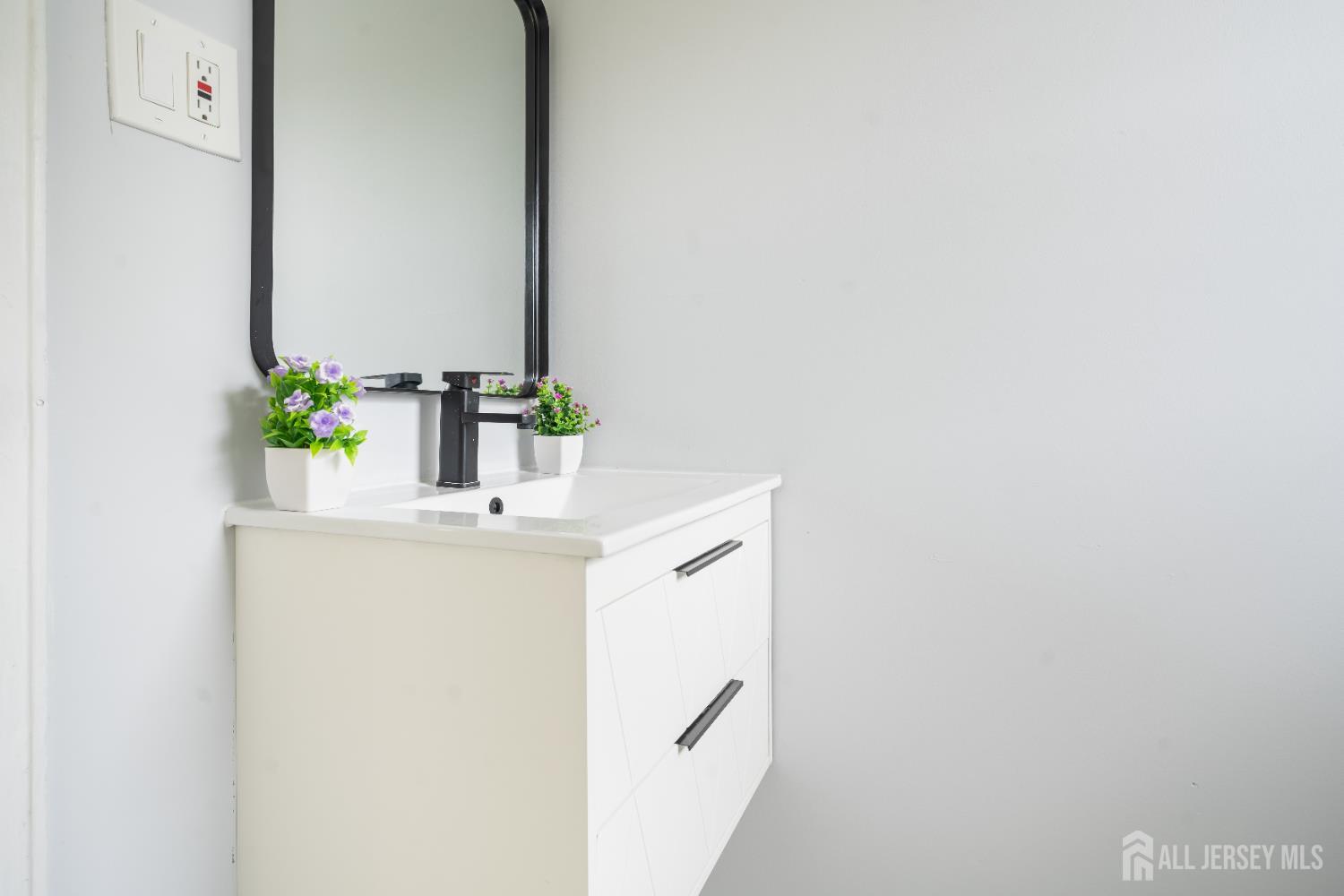 106 Boulevard West Old Bridge, NJ 07735 - Photo 19 of 34 a bathroom with a sink and a mirror