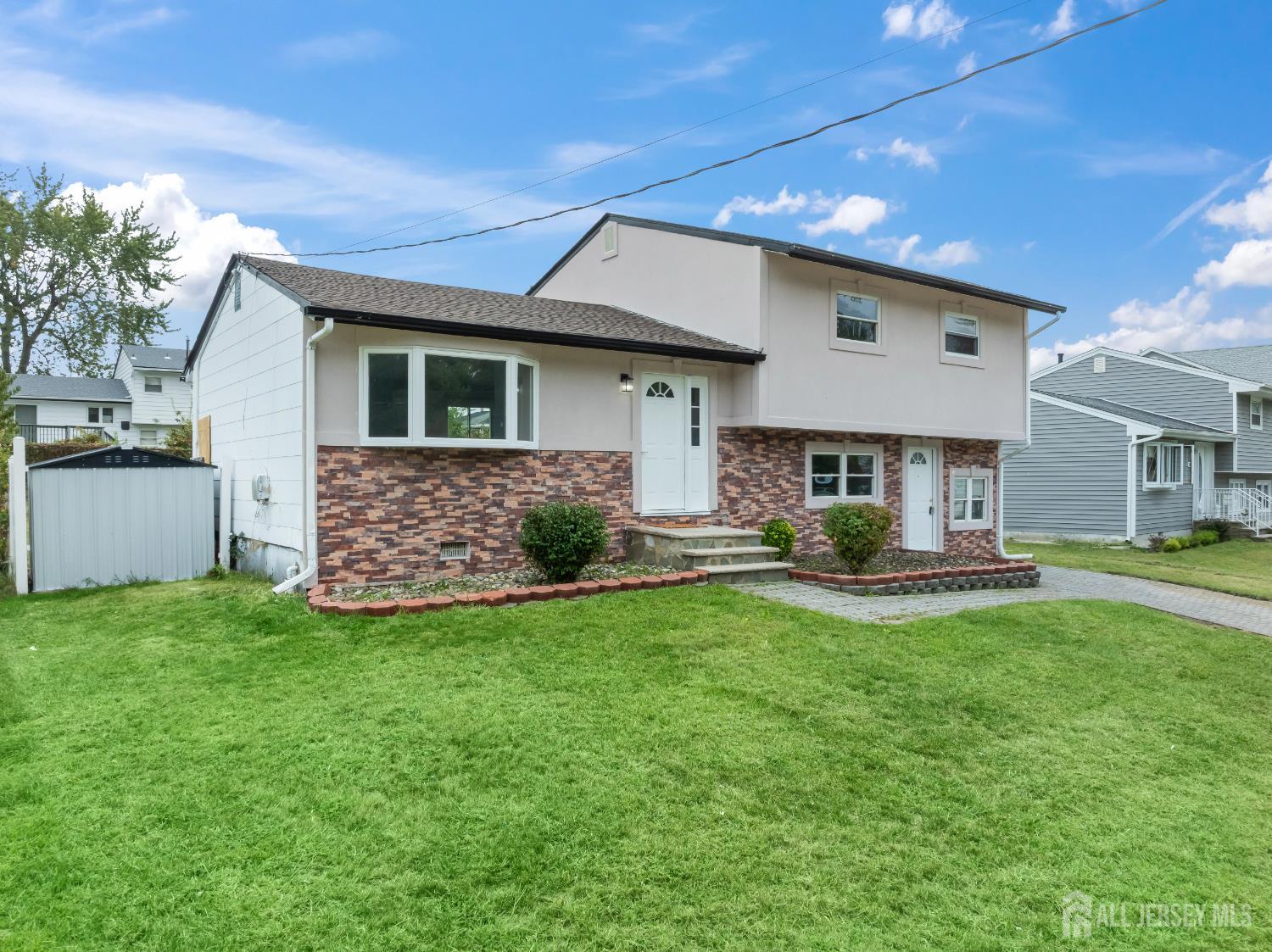 106 Boulevard West Old Bridge, NJ 07735 - Photo 2 of 34 a front view of house with yard and outdoor seating