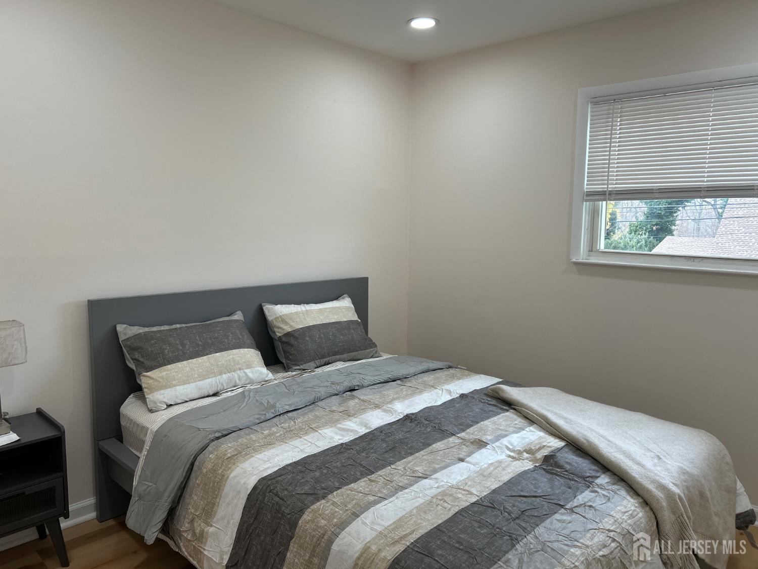106 Boulevard West Old Bridge, NJ 07735 - Photo 24 of 34 a bedroom with a bed and a window
