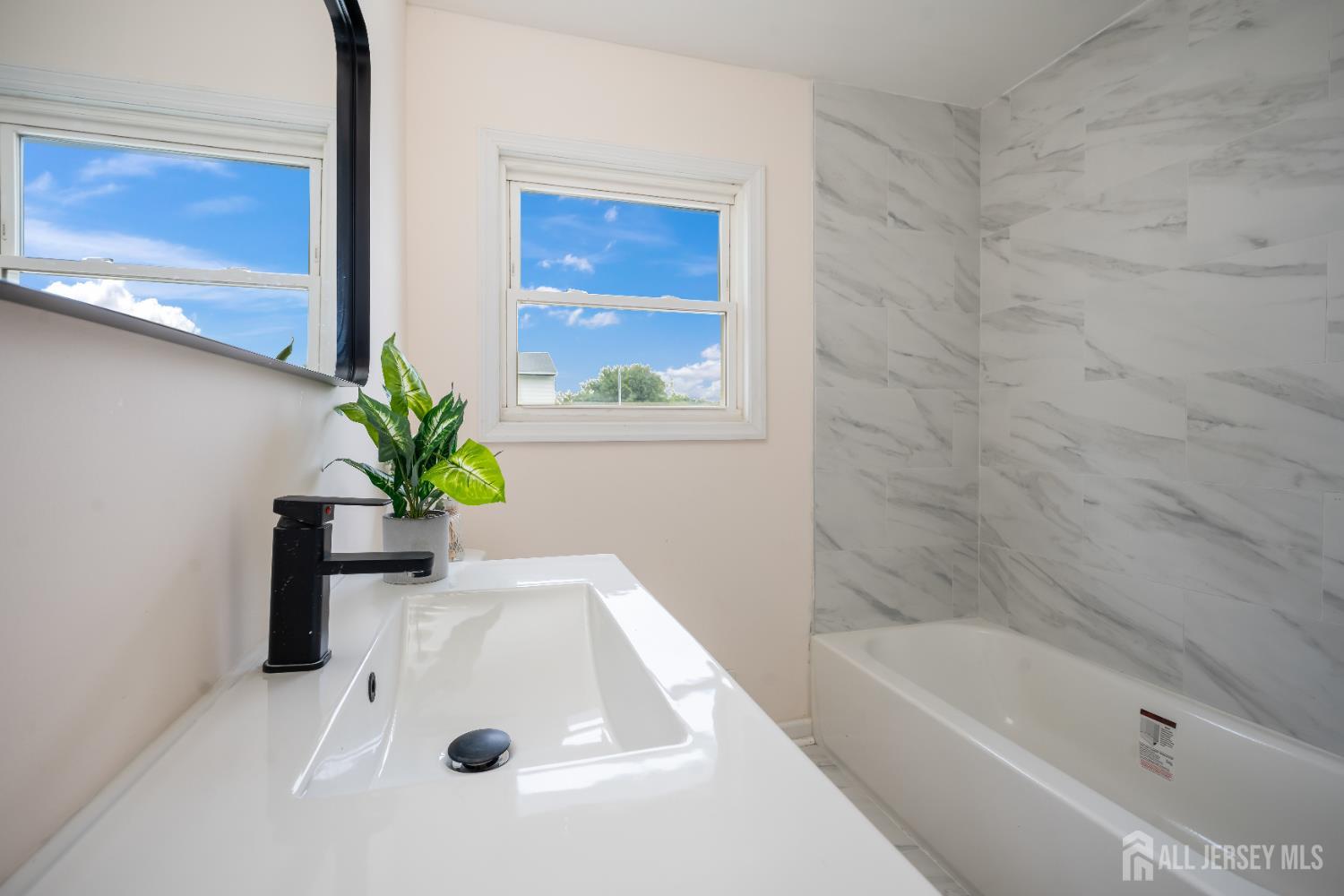 106 Boulevard West Old Bridge, NJ 07735 - Photo 27 of 34 a bathroom with a tub