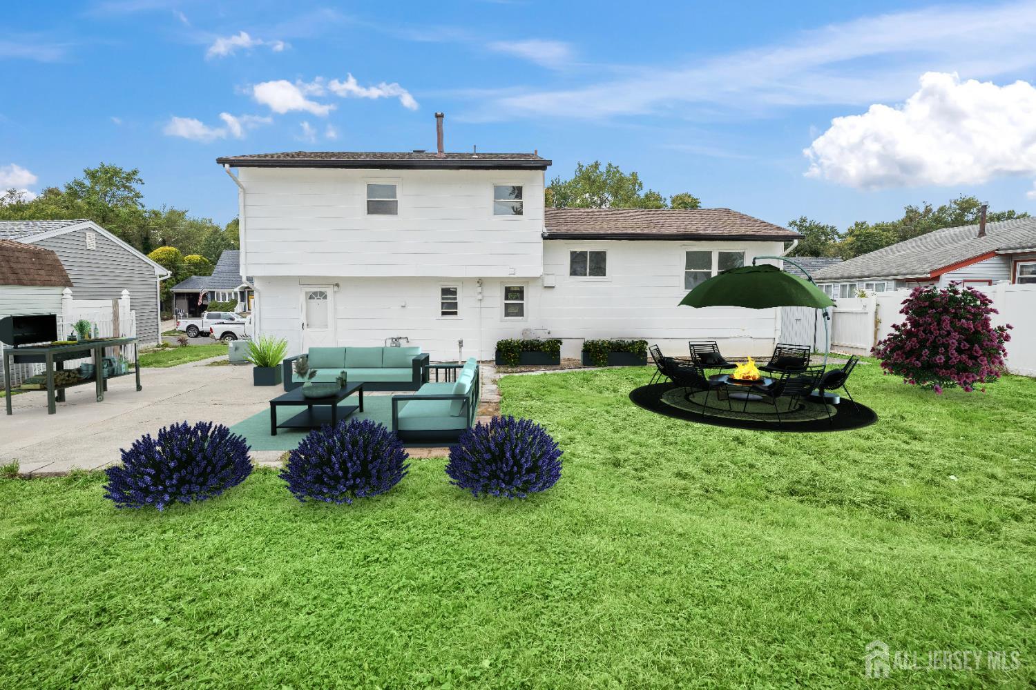106 Boulevard West Old Bridge, NJ 07735 - Photo 30 of 34 a view of a house with backyard sitting area and garden