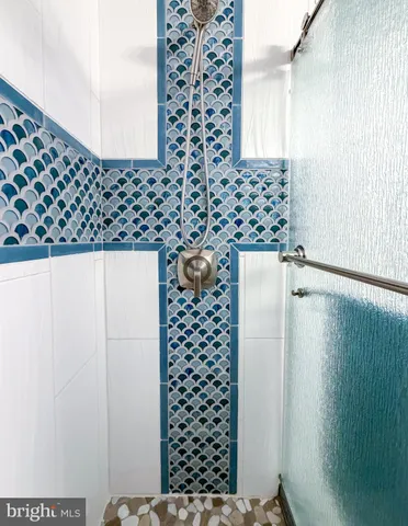 a bathroom with a bathtub and a shower curtain
