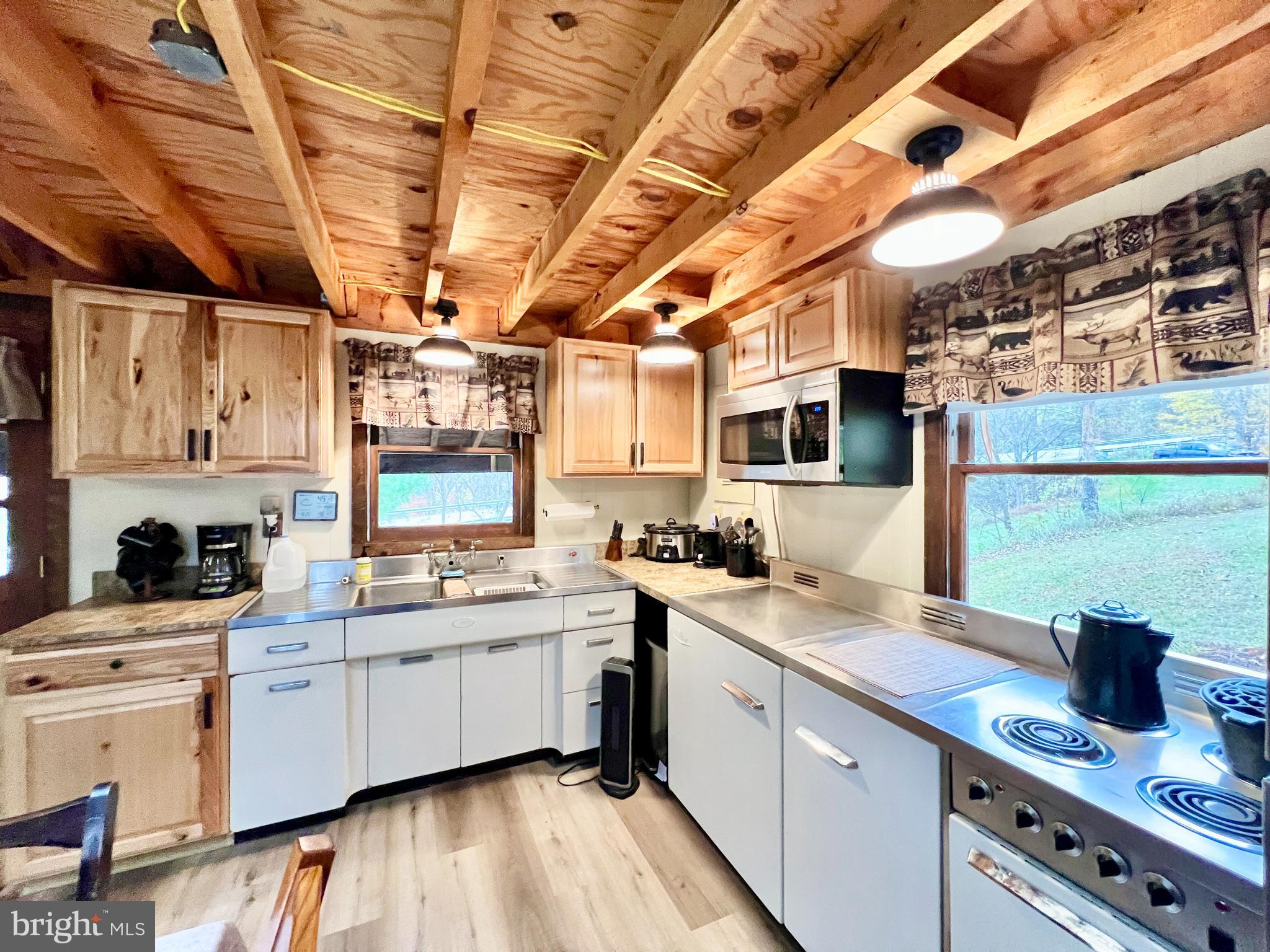 1858 Sandy Run Road Hopewell, PA 16650 - Photo 13 of 35 a kitchen with a sink stove and cabinets