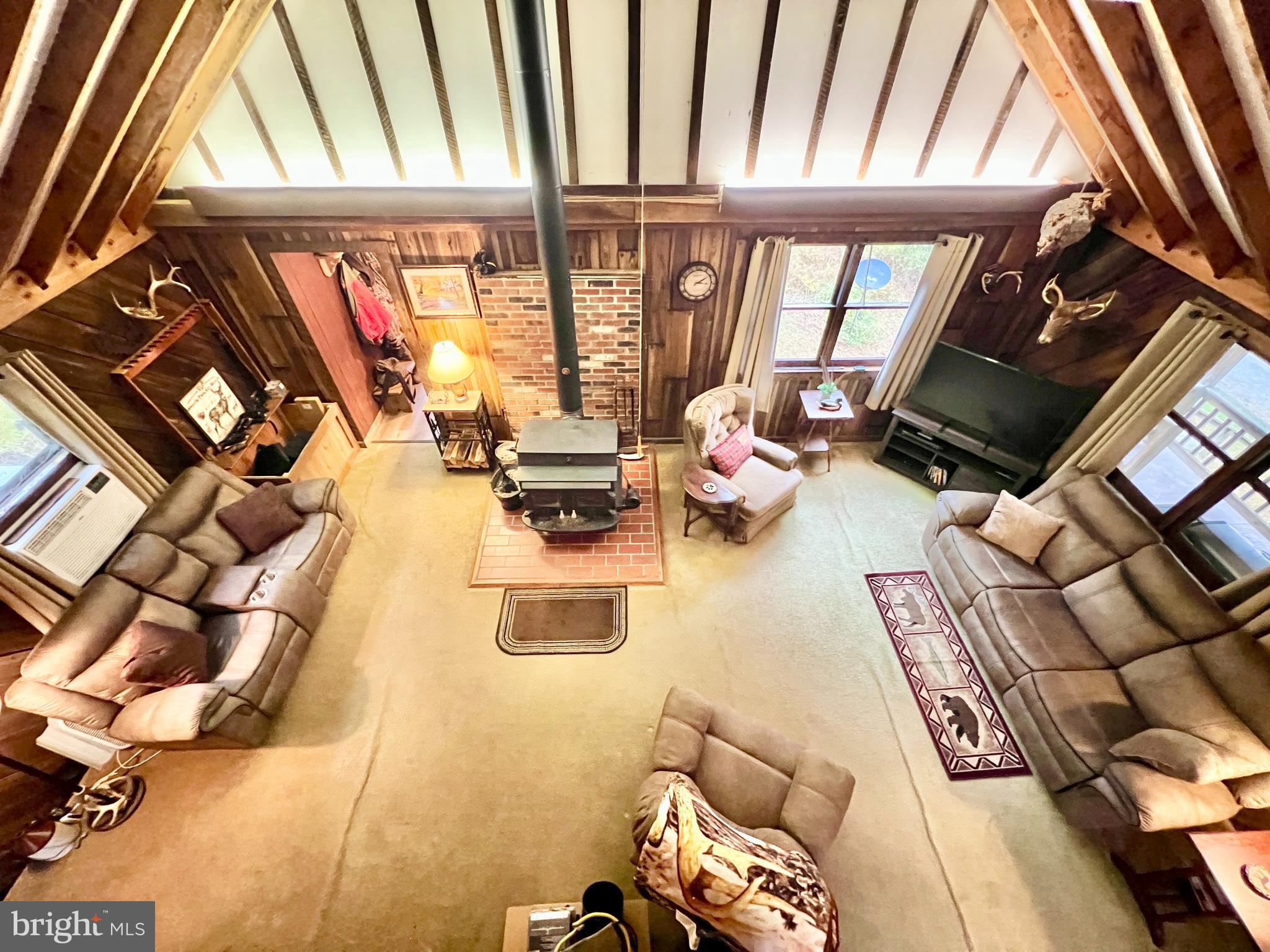 1858 Sandy Run Road Hopewell, PA 16650 - Photo 24 of 35 a view of living room with furniture and a floor to ceiling window