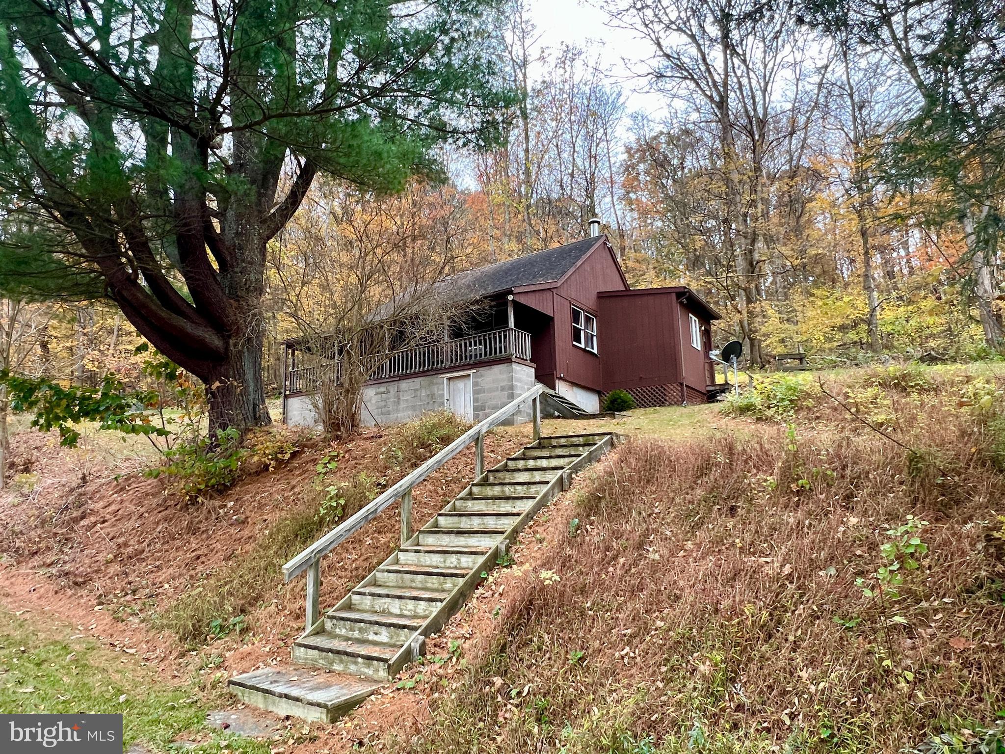 1858 Sandy Run Road Hopewell, PA 16650 - Photo 3 of 35 a pathway of a house with a yard