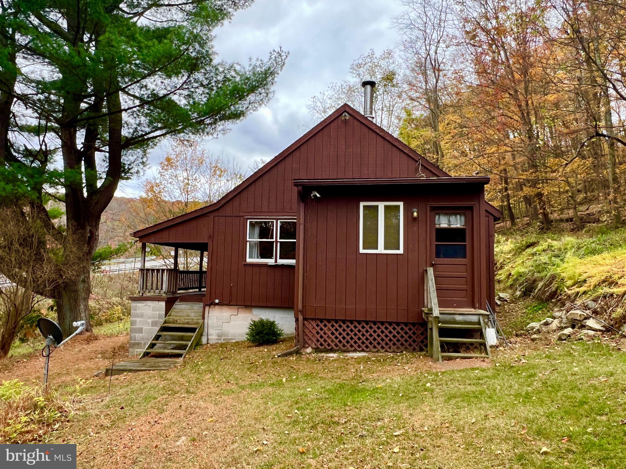 1858 Sandy Run Road Hopewell, PA 16650 - Photo 5 of 35 a front view of a house with a yard
