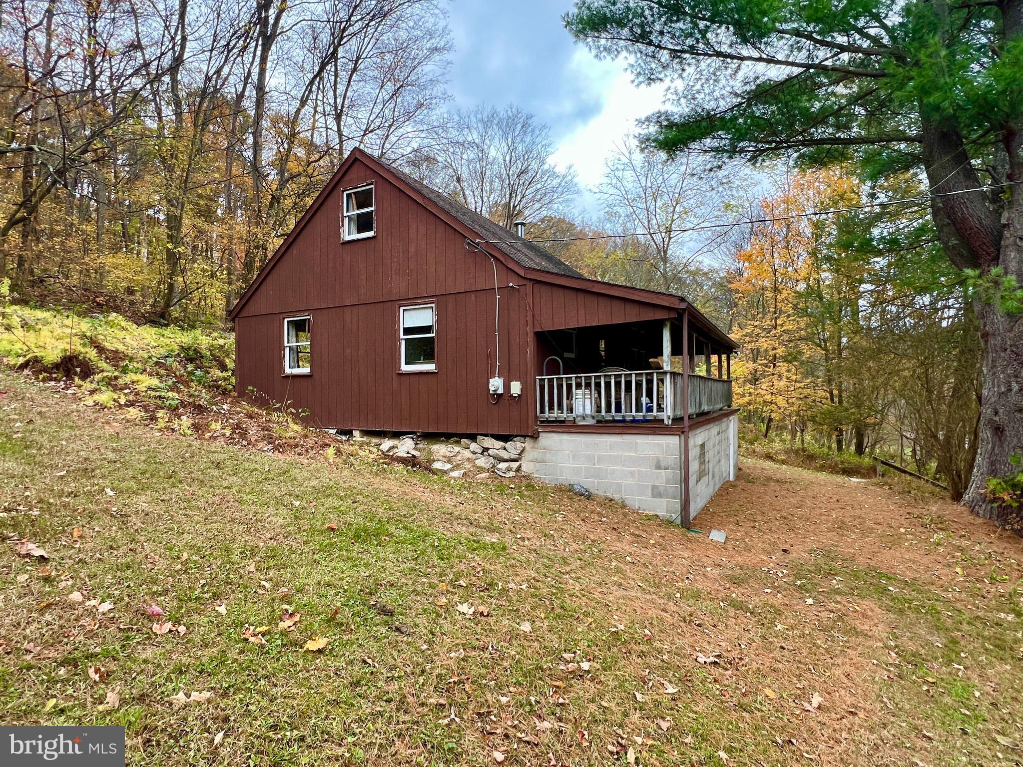1858 Sandy Run Road Hopewell, PA 16650 - Photo 8 of 35 a front view of a house with a yard and garage