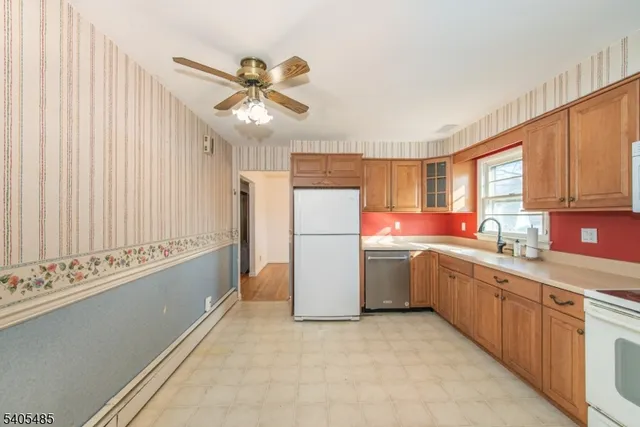 a kitchen with sink cabinets and window