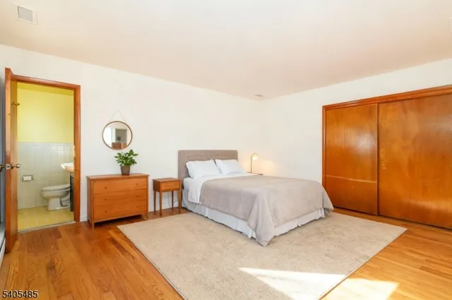 a bedroom with a bed and a table