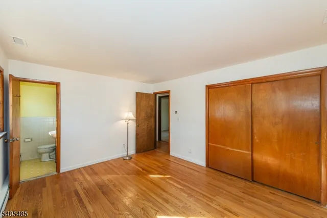 a bedroom with a bed and a shower