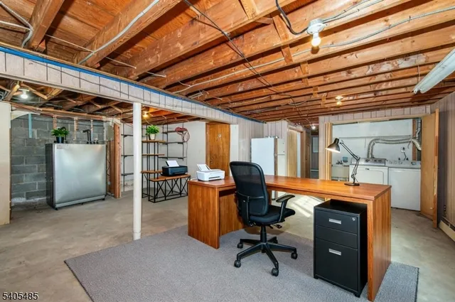 a view of a workspace with furniture