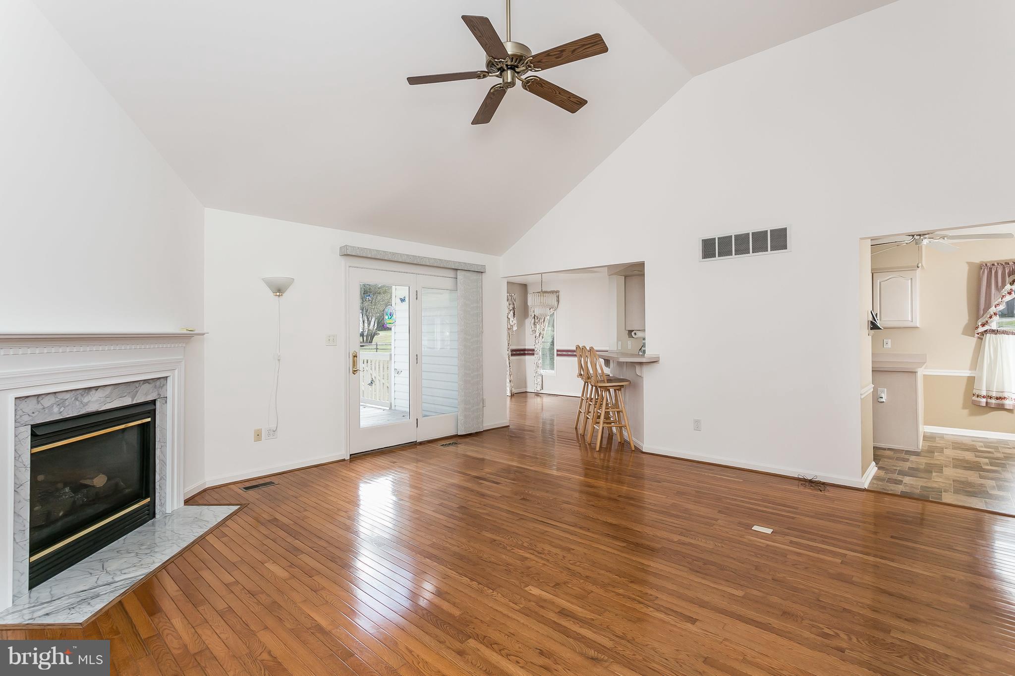 11913 Manor Road Glen Arm, MD 21057 - Photo 7 of 47 Living Room w/ Gleaming Hardwoods & Cozy Fireplace