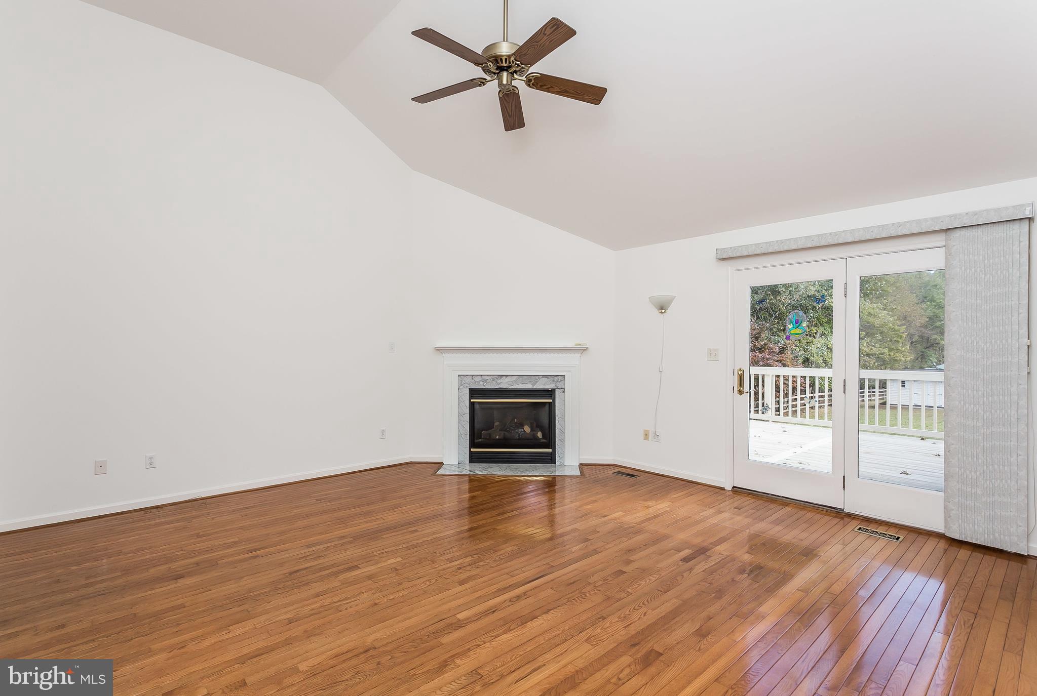 11913 Manor Road Glen Arm, MD 21057 - Photo 8 of 47 Living Room w/ 13ft Ceilings and Sliders to Deck
