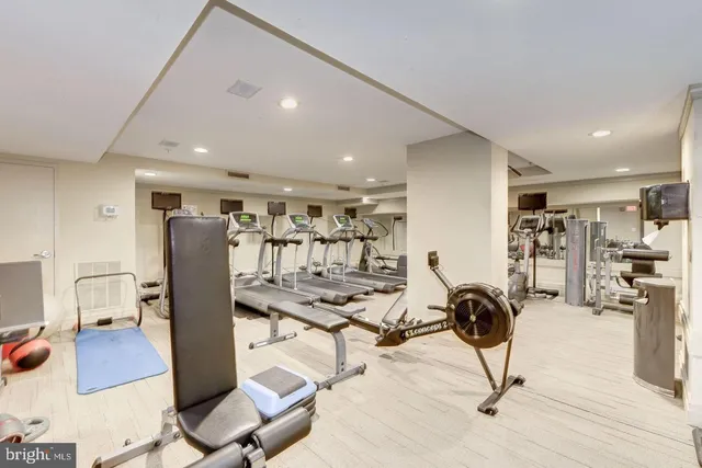a view of a chairs and table in the balcony