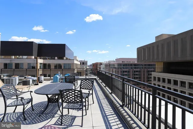 a view of a patio with table and chairs