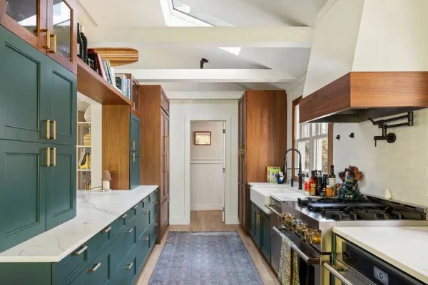 a kitchen with stainless steel appliances a stove and a refrigerator