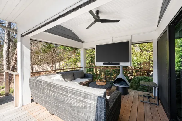 a room with furniture and a flat screen tv